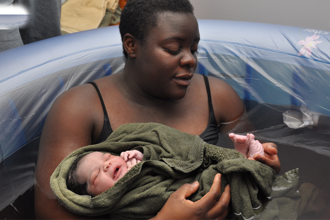 mother holding newborn baby