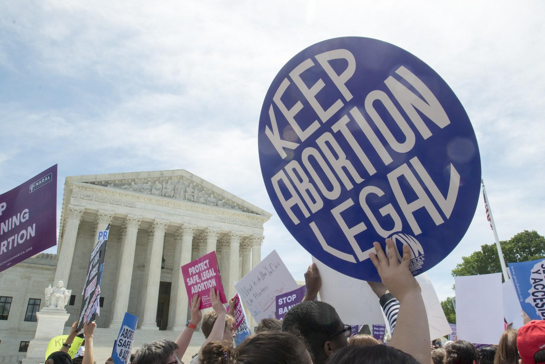 Protesters demonstrate outside the Supreme Court