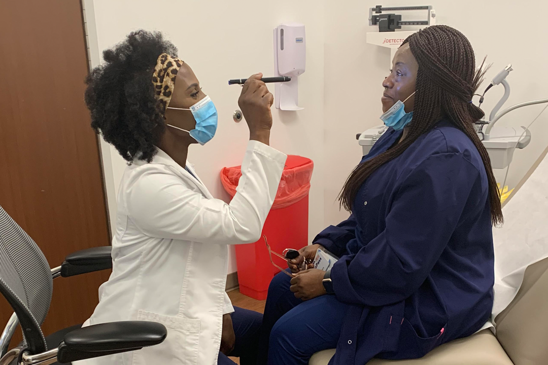 Cynthia Awadzi with a patient