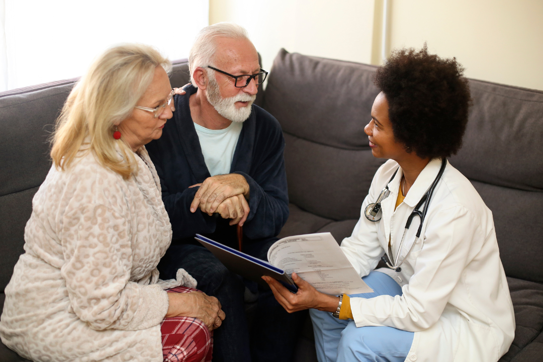 Geriatric couple meeting with nurse