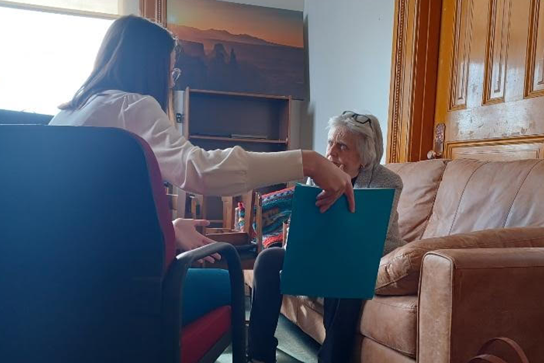 Ashley Fry speaking with woman at Colorado State House