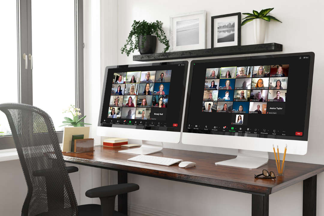 two computer monitors displaying zoom sessions with students