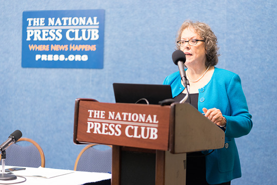 Professor speaking at press conference