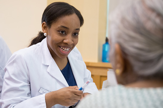 grad student working with geriatric patient