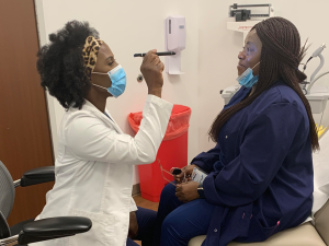 Cynthia Awadzi with a patient
