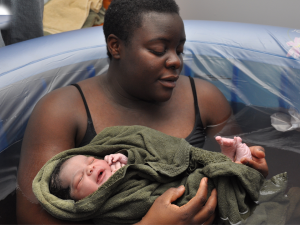 mother holding newborn baby