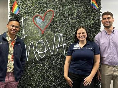 Jeffrey Kai, Skye Bennett and Shawn Bayrd posing in front of an 'I love Inova' sign