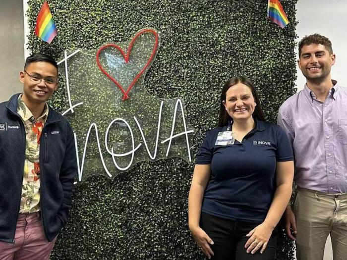 Jeffrey Kai, Skye Bennett and Shawn Bayrd posing in front of an 'I love Inova' sign