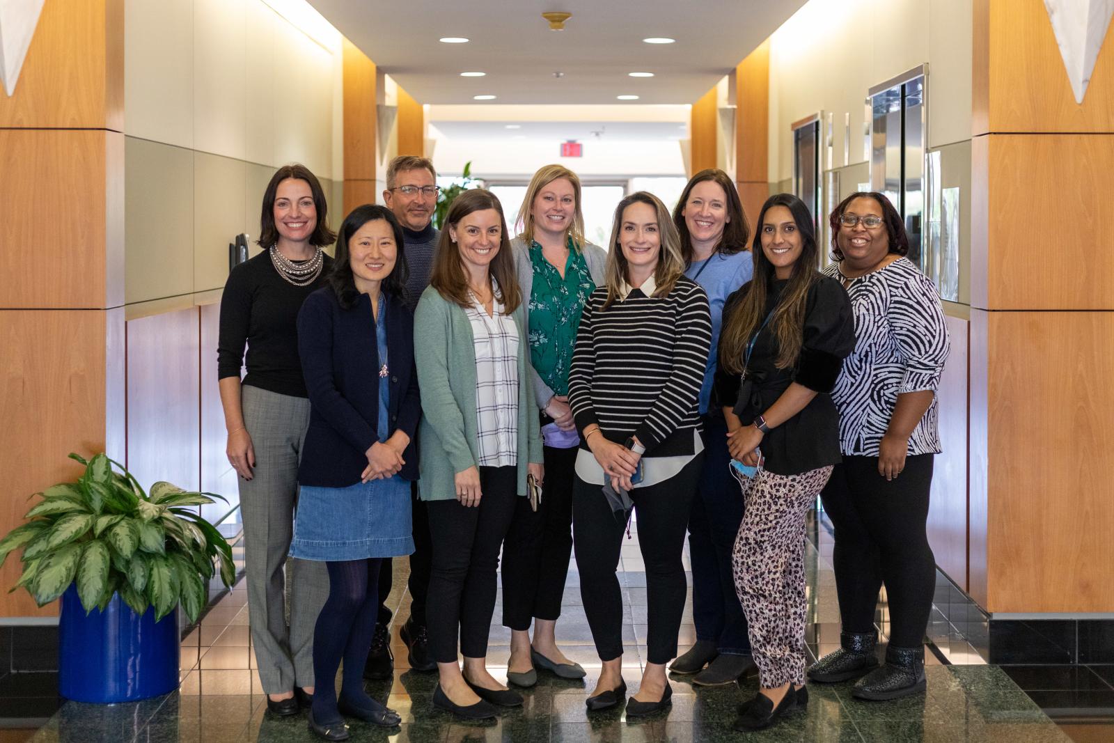 Group of PhD students pose in the hallway during Fall intensive sessions