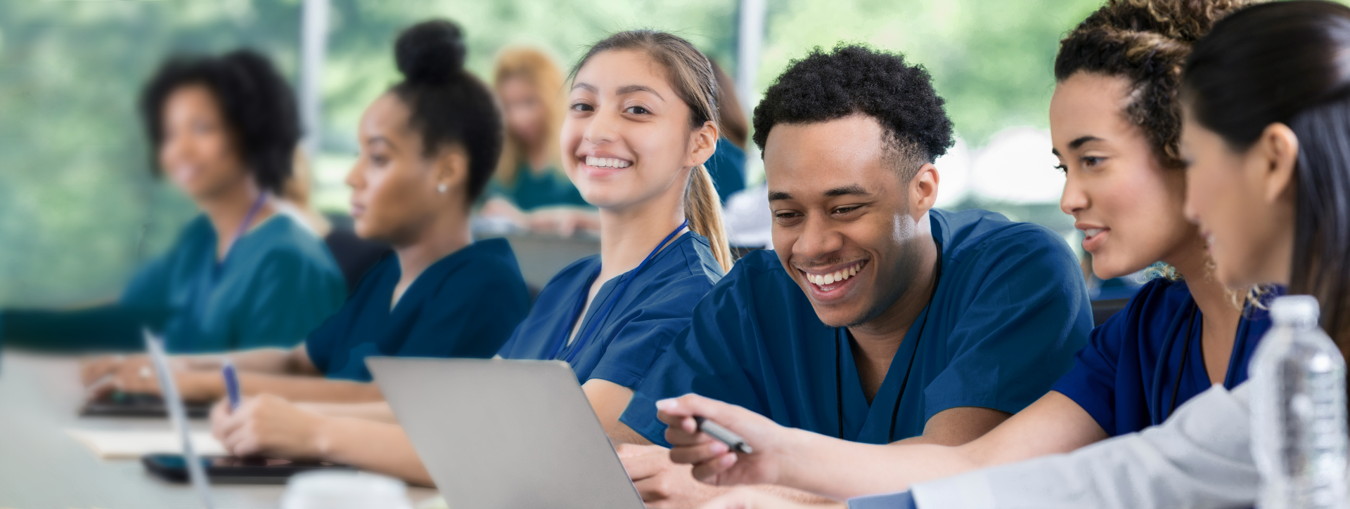 nursing students smiling in classroom