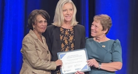 Sarah Beebe receiving award from NLN