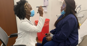 Cynthia Awadzi with a patient